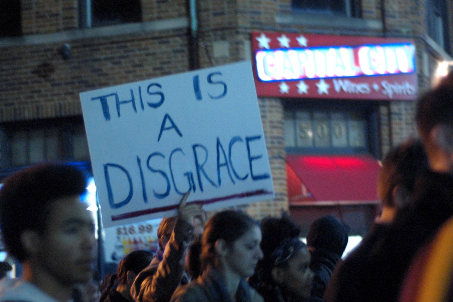 Protest sign: This Is A Disgrace